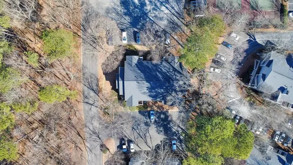 a view of outside house with a yard