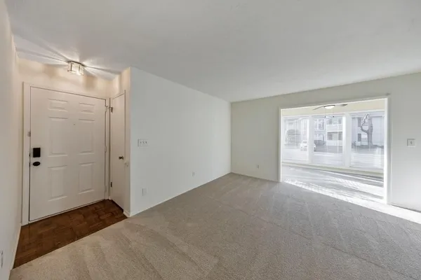 a view of empty room with front door