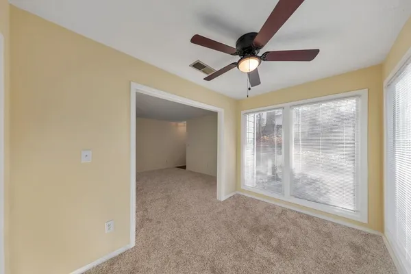 a view of an empty room with a window