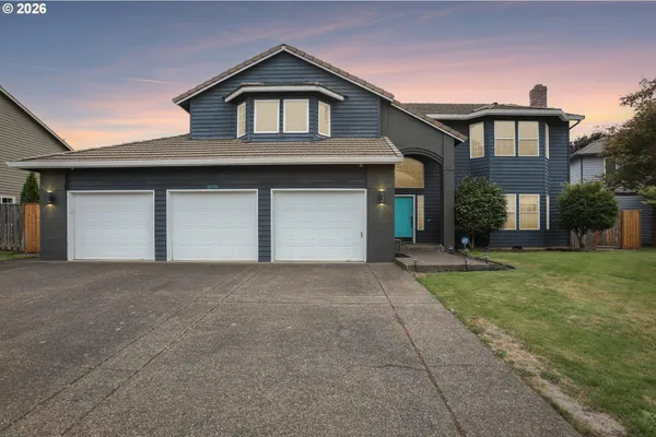 a front view of a house with garage