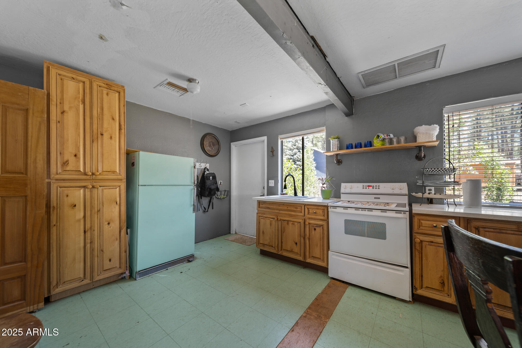 247 Standage Drive Payson, AZ 85541 - Photo 20 of 33 a kitchen with a refrigerator and a stove