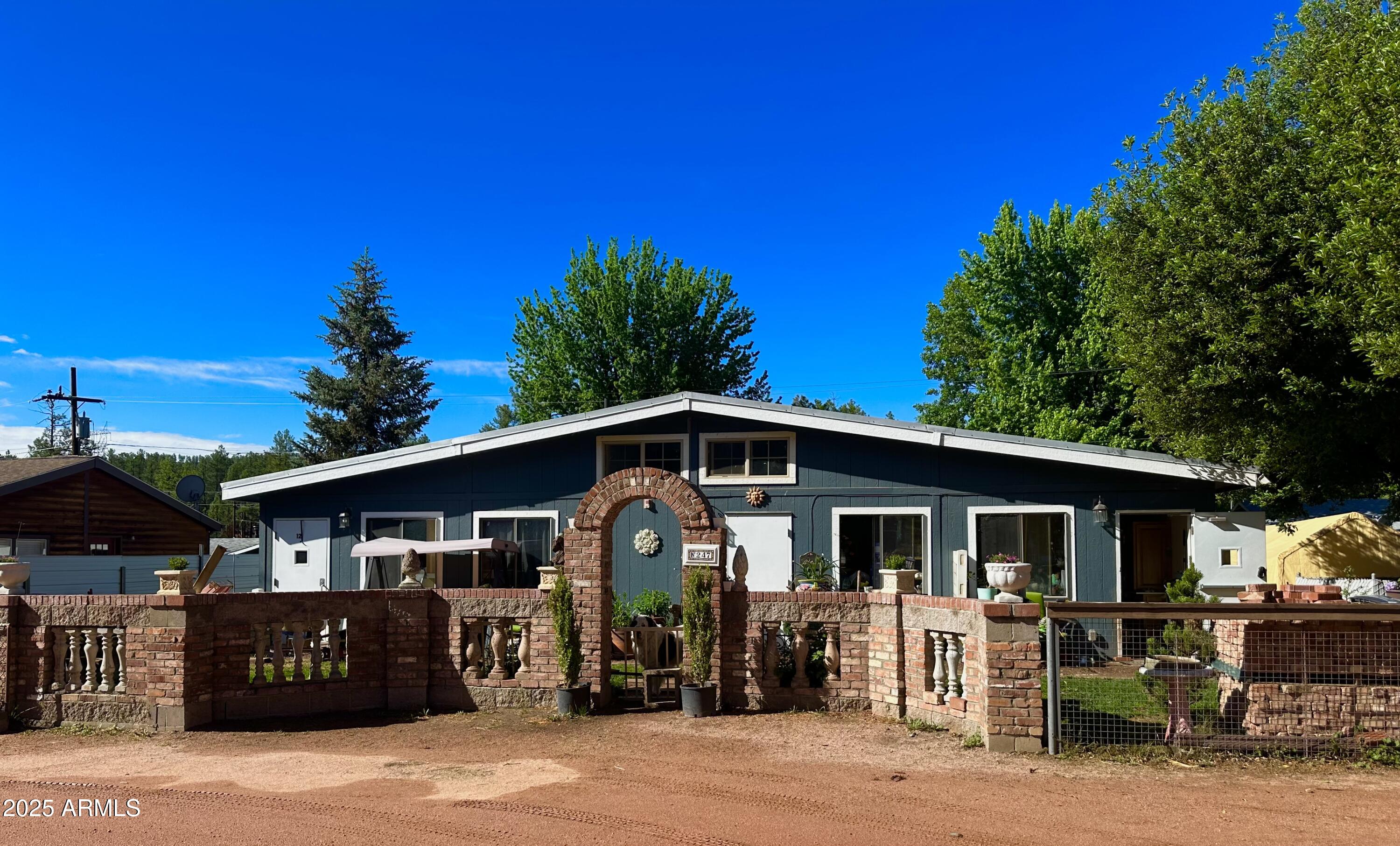 247 Standage Drive Payson, AZ 85541 - Photo 10 of 33 a front view of a house with a porch