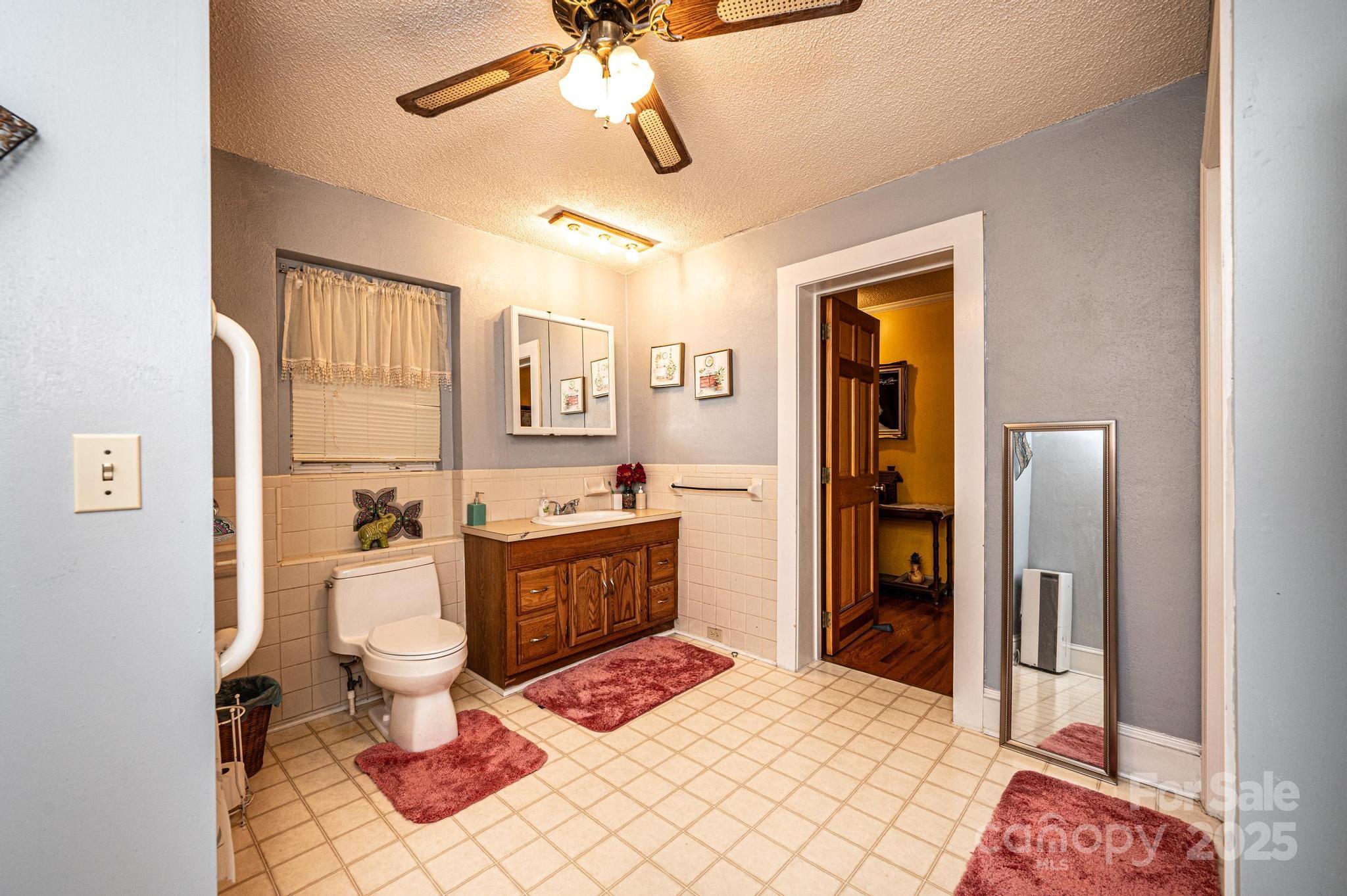 129 38th Street Northwest Hickory, NC 28601 - Photo 11 of 30 a large bedroom with a bed and a chandelier