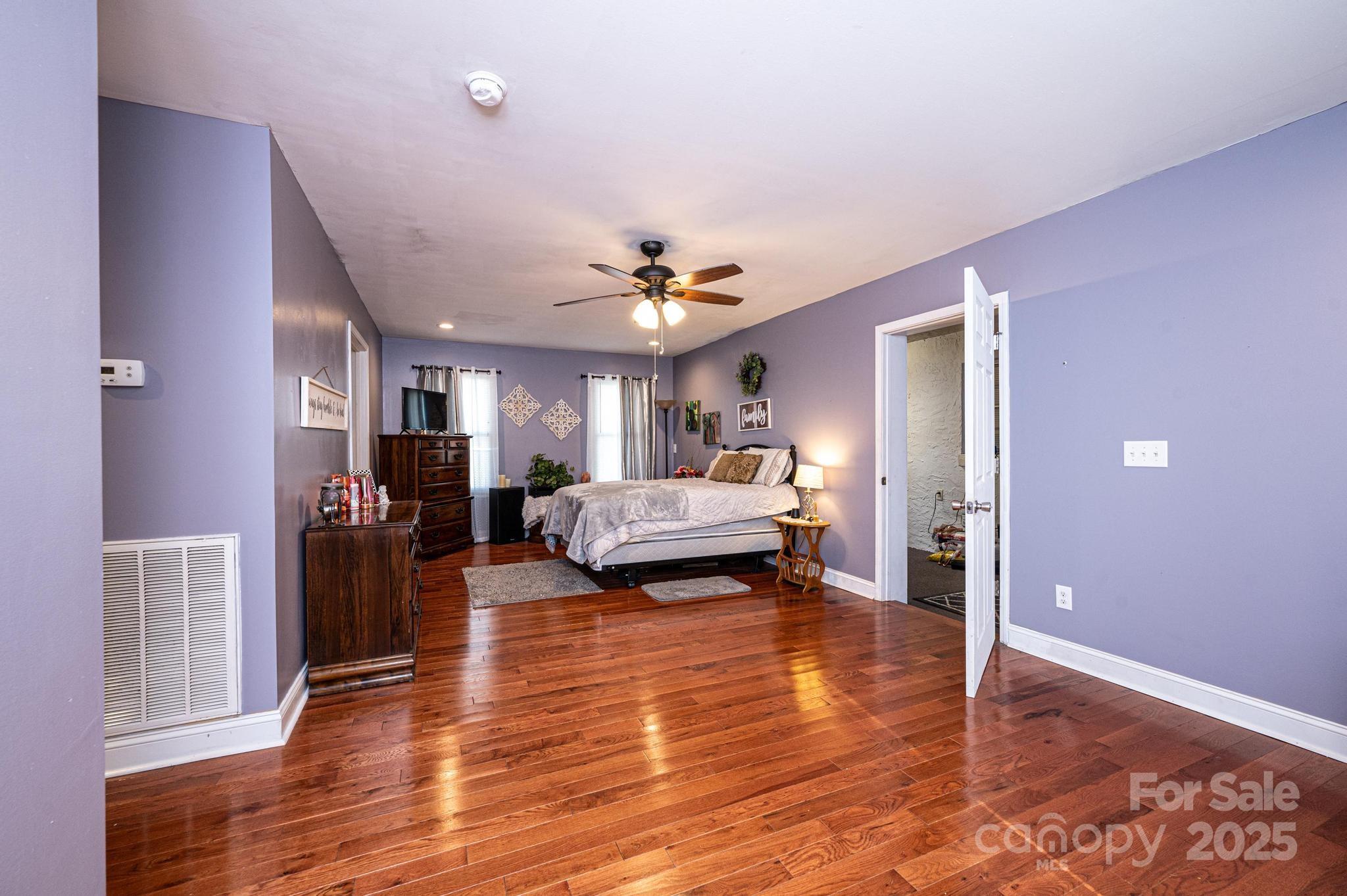 129 38th Street Northwest Hickory, NC 28601 - Photo 18 of 30 a view of a livingroom with furniture and a ceiling fan