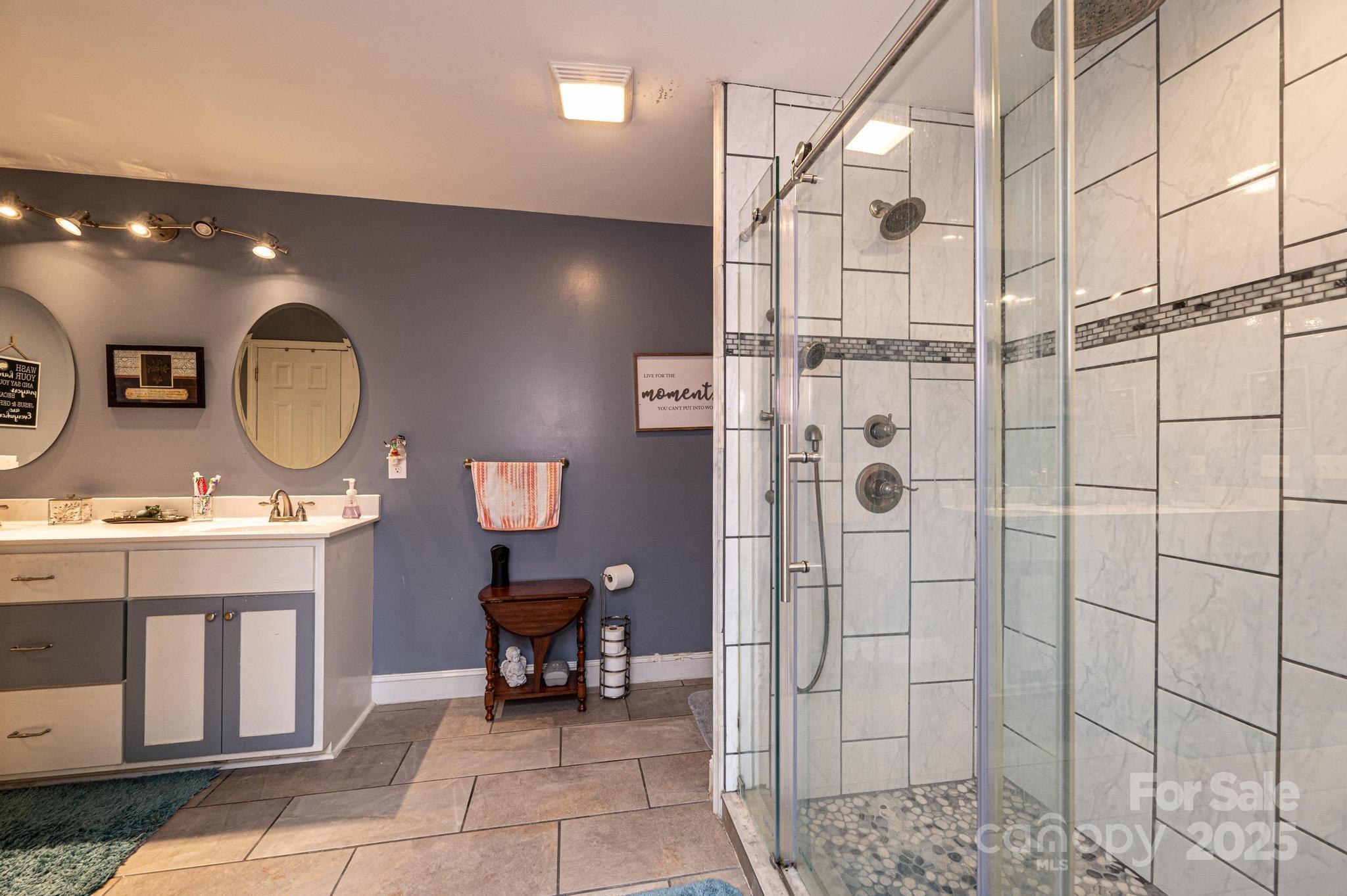 129 38th Street Northwest Hickory, NC 28601 - Photo 20 of 30 a bathroom with a toilet a sink and a mirror