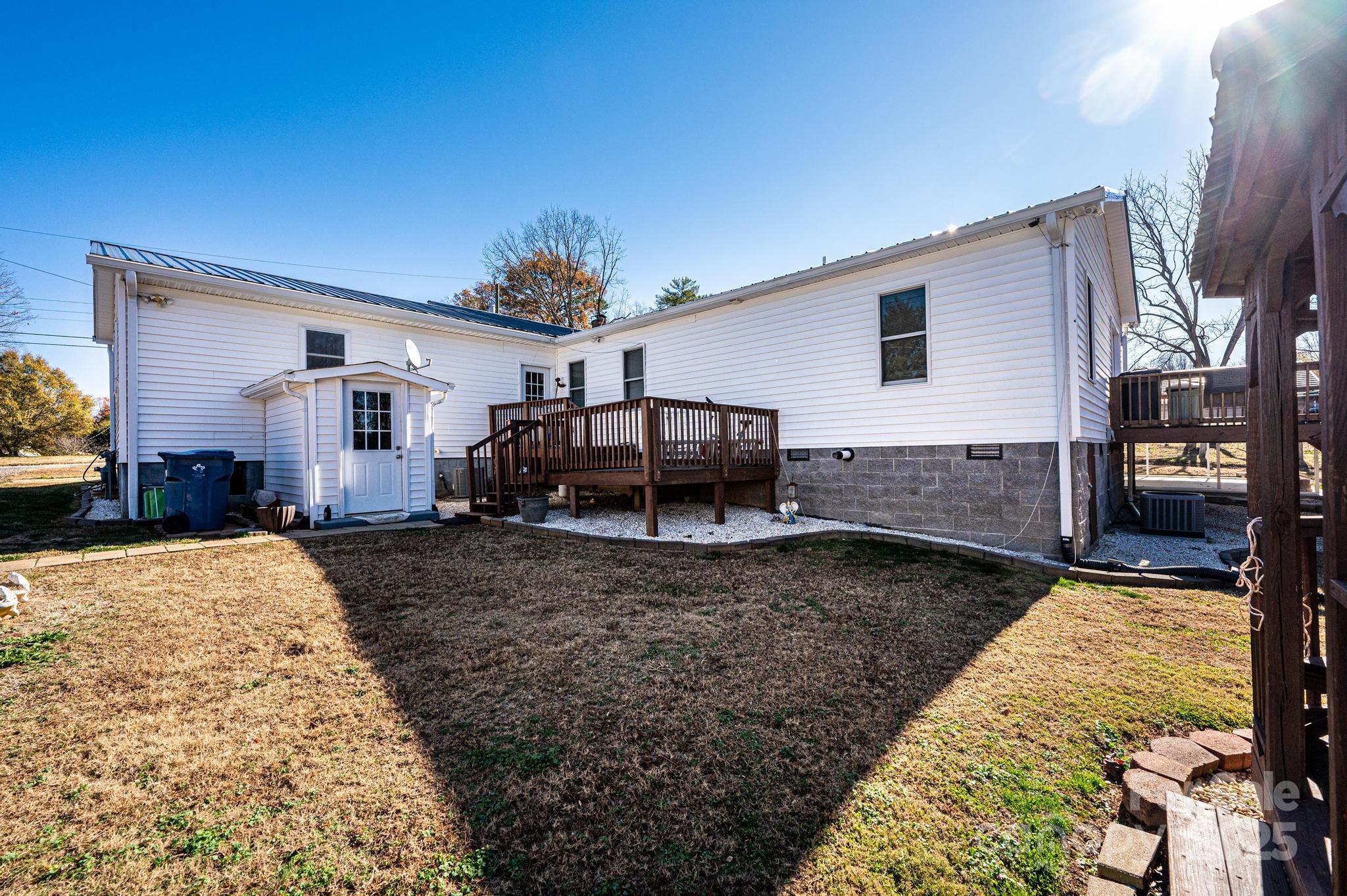129 38th Street Northwest Hickory, NC 28601 - Photo 2 of 30 a view of a house with backyard and sitting area