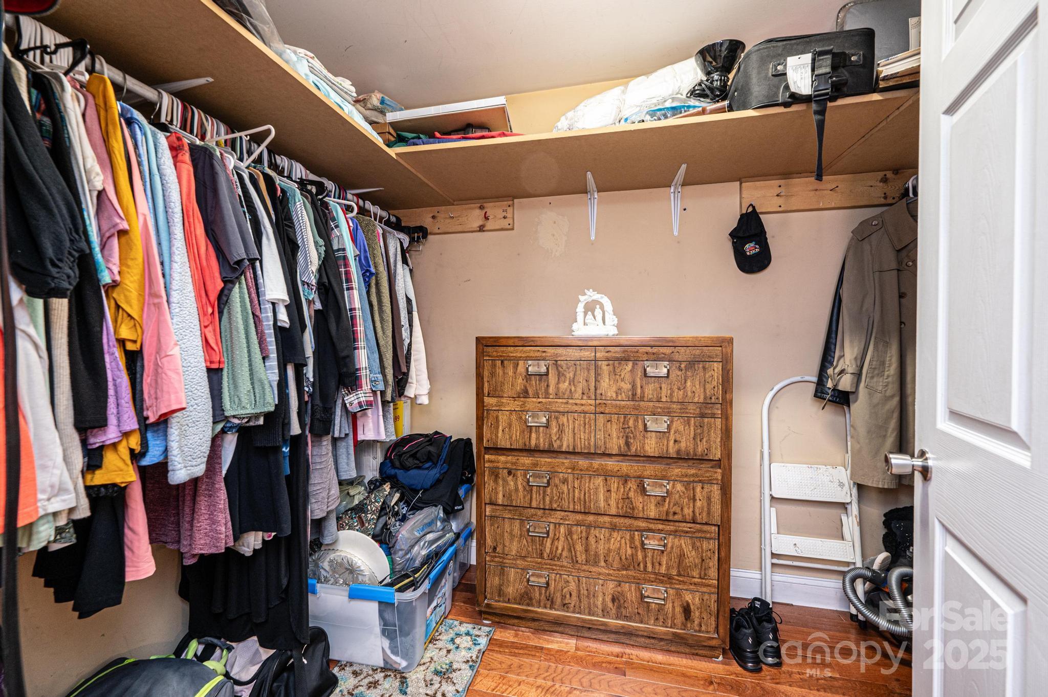129 38th Street Northwest Hickory, NC 28601 - Photo 22 of 30 a view of walk in closet with clothes and shoes