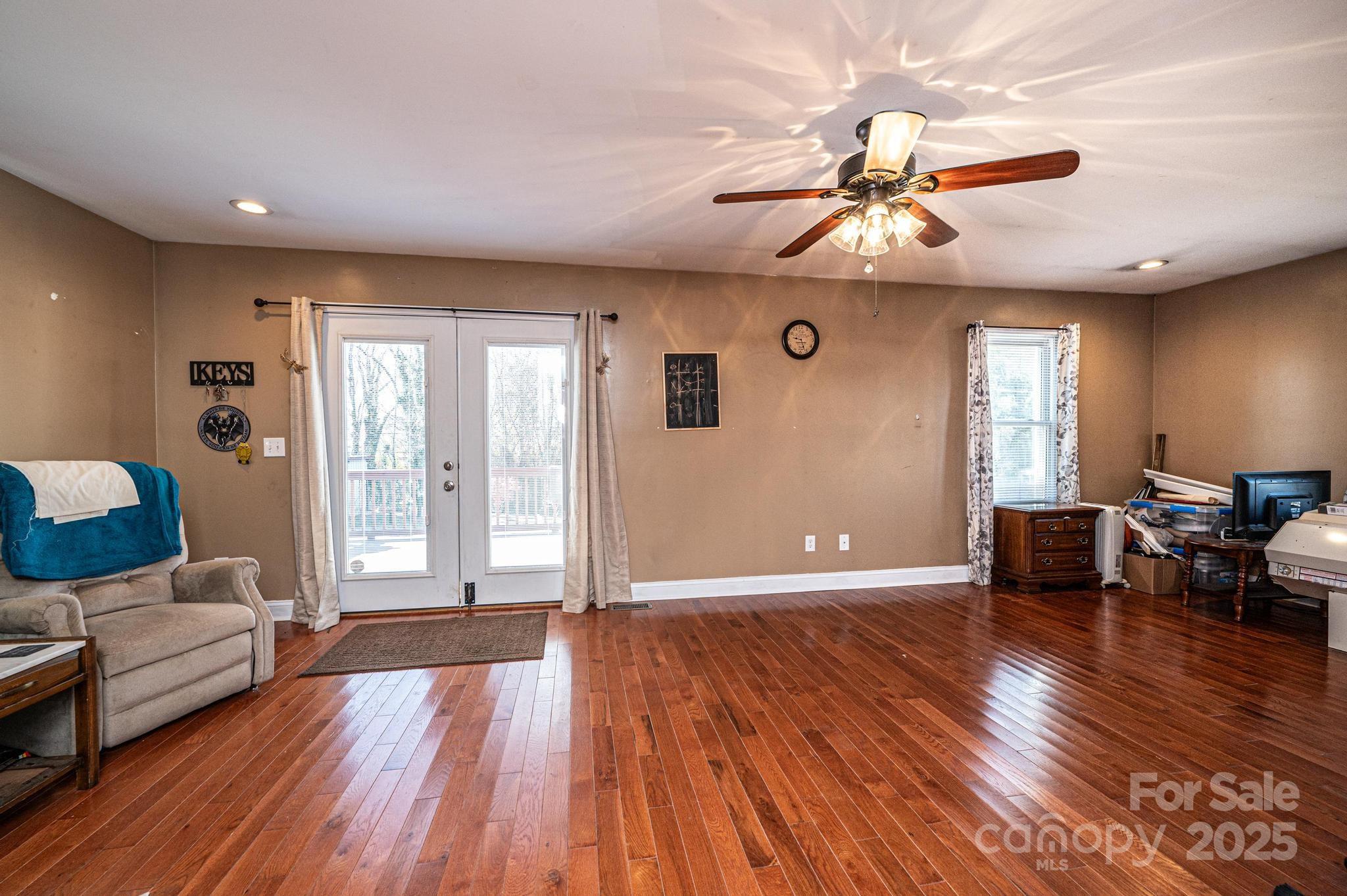 129 38th Street Northwest Hickory, NC 28601 - Photo 23 of 30 a living room with furniture and wooden floor