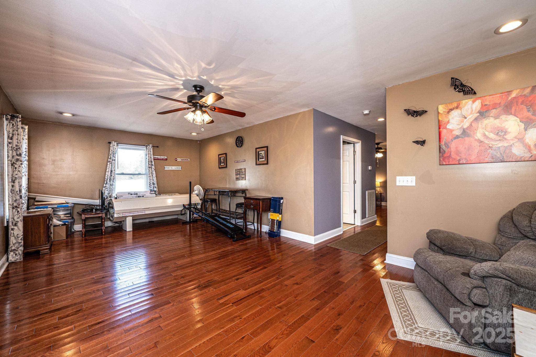 129 38th Street Northwest Hickory, NC 28601 - Photo 24 of 30 a living room with furniture and wooden floor