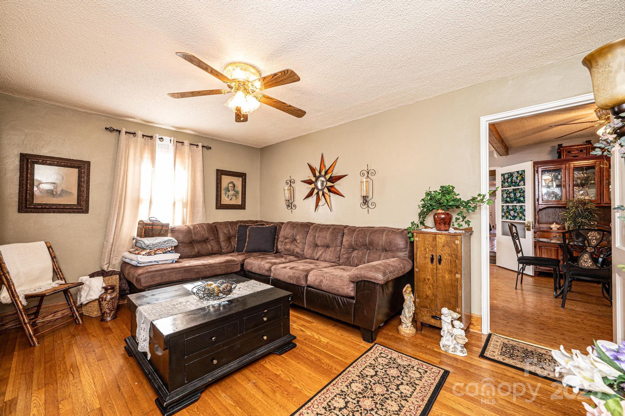 129 38th Street Northwest Hickory, NC 28601 - Photo 3 of 30 a living room with furniture and a rug