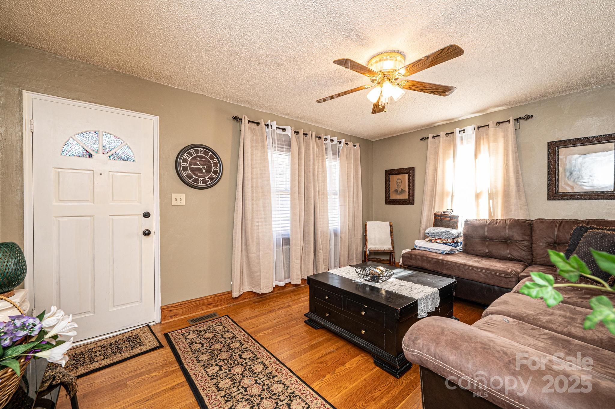 129 38th Street Northwest Hickory, NC 28601 - Photo 4 of 30 a living room with furniture and a large window