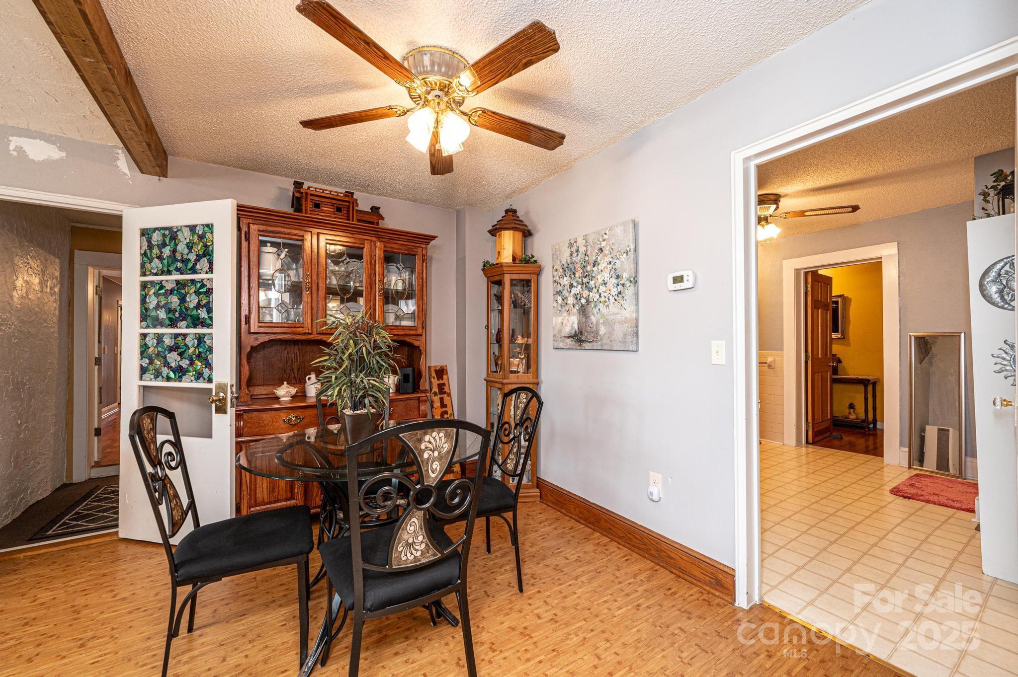 129 38th Street Northwest Hickory, NC 28601 - Photo 5 of 30 a view of a dining room with furniture and chandelier