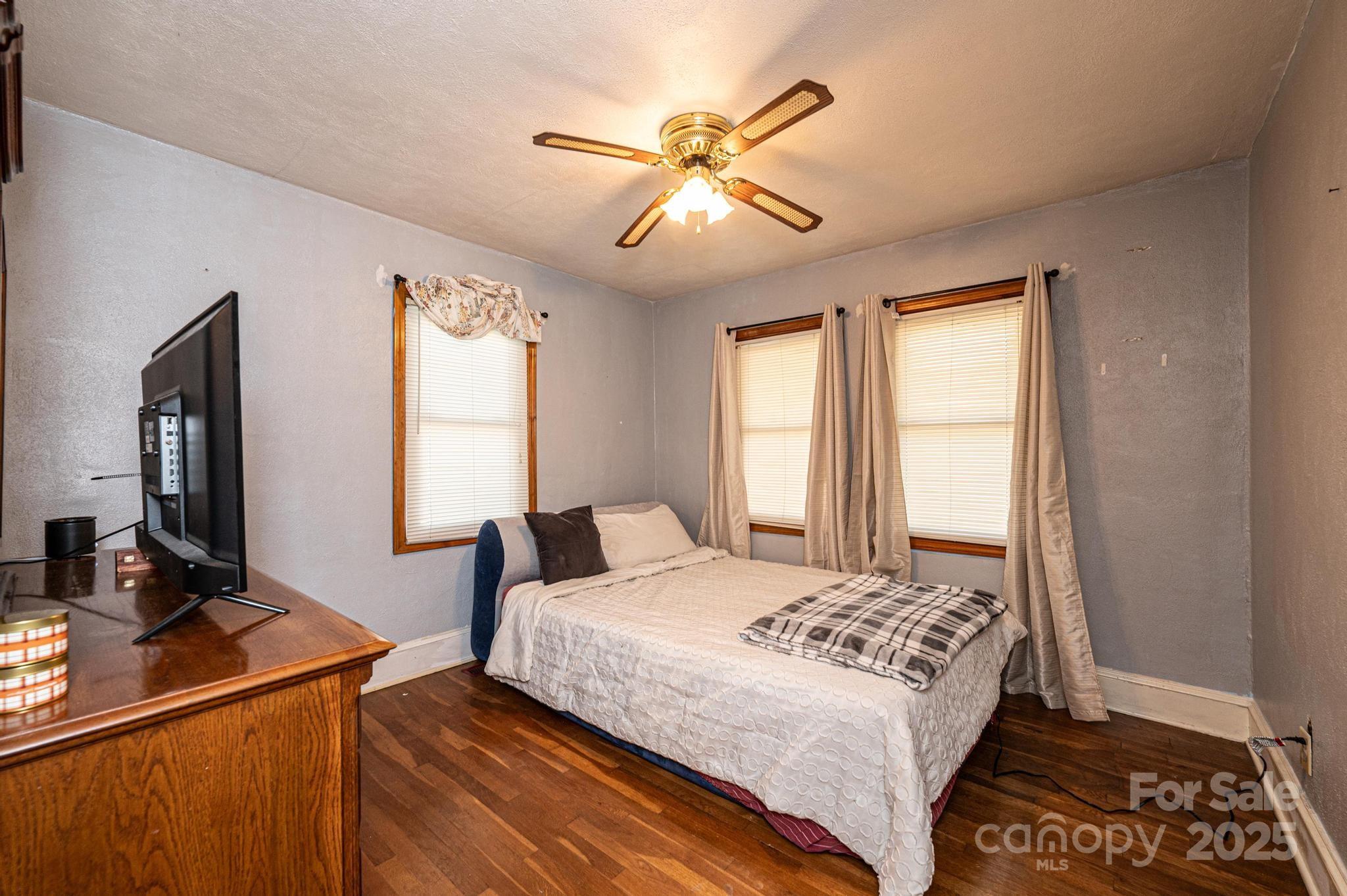 129 38th Street Northwest Hickory, NC 28601 - Photo 10 of 30 a bedroom with a large bed and a window