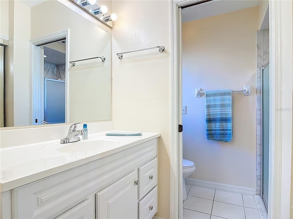 4761 Riverglen Boulevard Ponce Inlet, FL 32127 - Photo 18 of 50 a bathroom with a sink toilet and shower