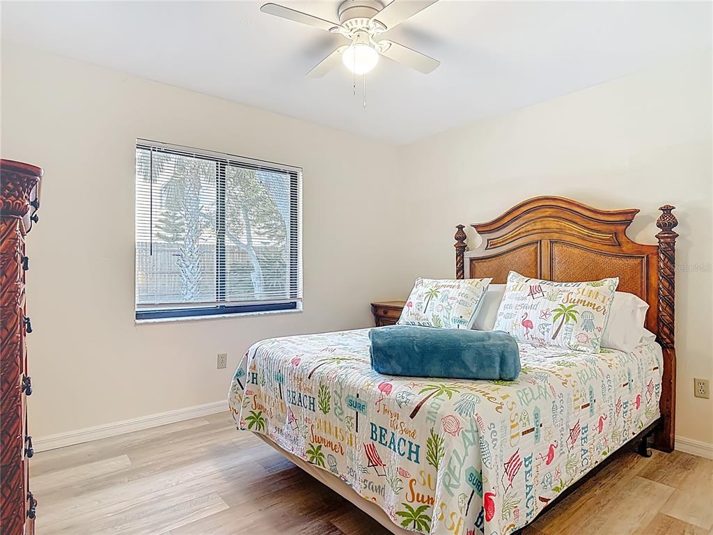 4761 Riverglen Boulevard Ponce Inlet, FL 32127 - Photo 22 of 50 a bedroom with a bed and window