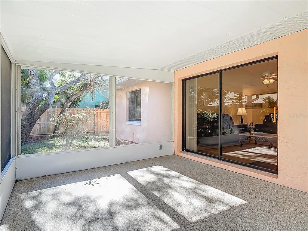 4761 Riverglen Boulevard Ponce Inlet, FL 32127 - Photo 31 of 50 a view of a big room with wooden floor and windows
