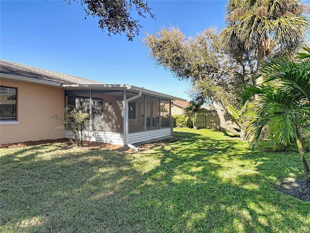 4761 Riverglen Boulevard Ponce Inlet, FL 32127 - Photo 32 of 50 a view of a house with a yard