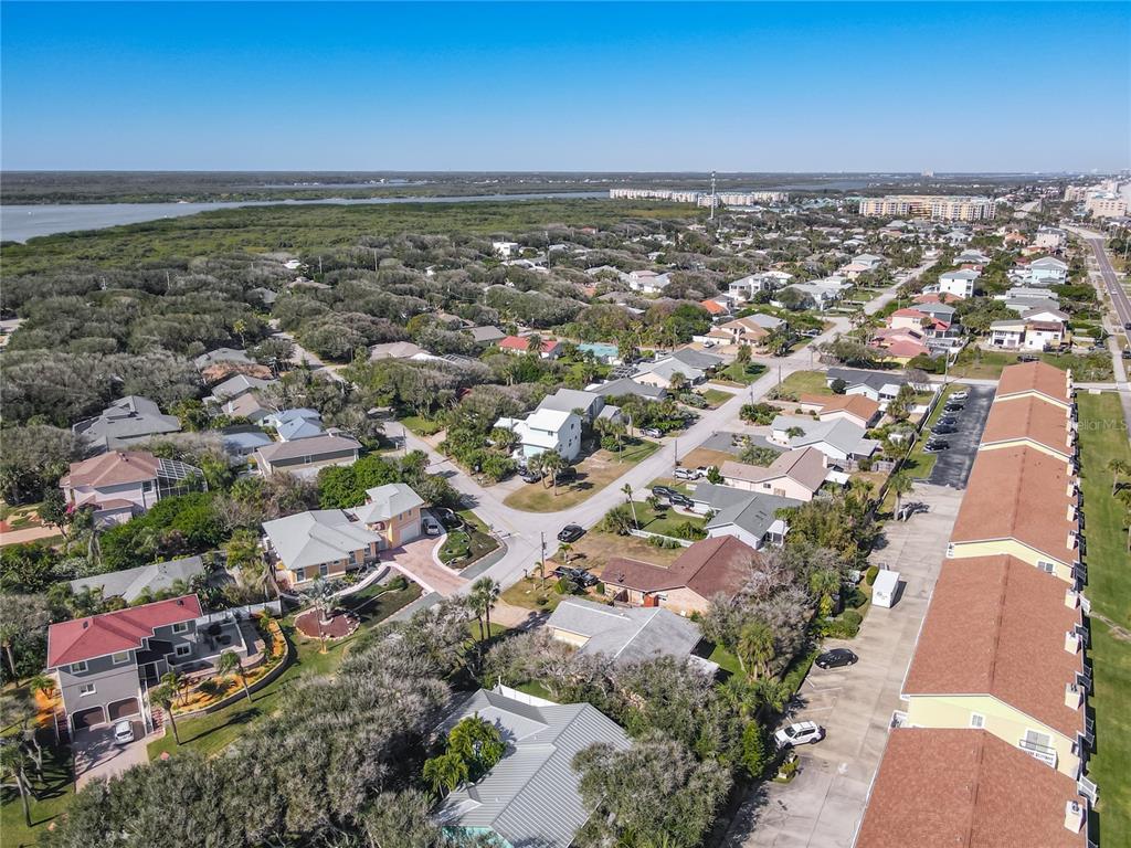 4761 Riverglen Boulevard Ponce Inlet, FL 32127 - Photo 37 of 50 an aerial view of residential building with outdoor space