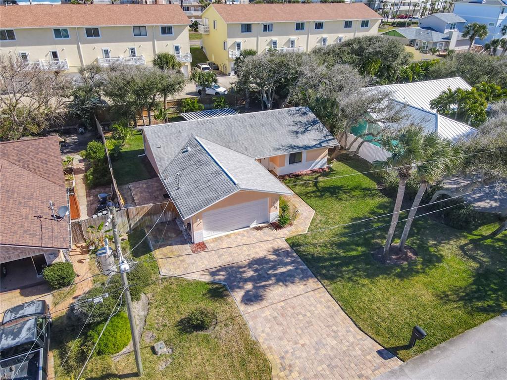 4761 Riverglen Boulevard Ponce Inlet, FL 32127 - Photo 40 of 50 an aerial view of a house with a garden