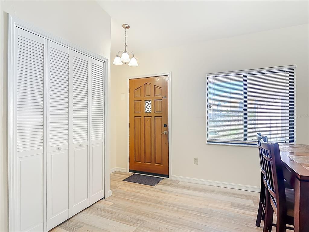 4761 Riverglen Boulevard Ponce Inlet, FL 32127 - Photo 5 of 50 a view of an empty room with wooden floor and a window