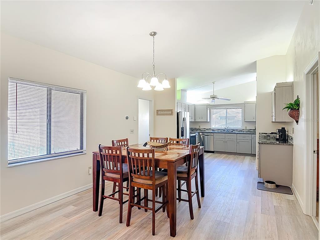 4761 Riverglen Boulevard Ponce Inlet, FL 32127 - Photo 6 of 50 a view of a dining room with furniture and window