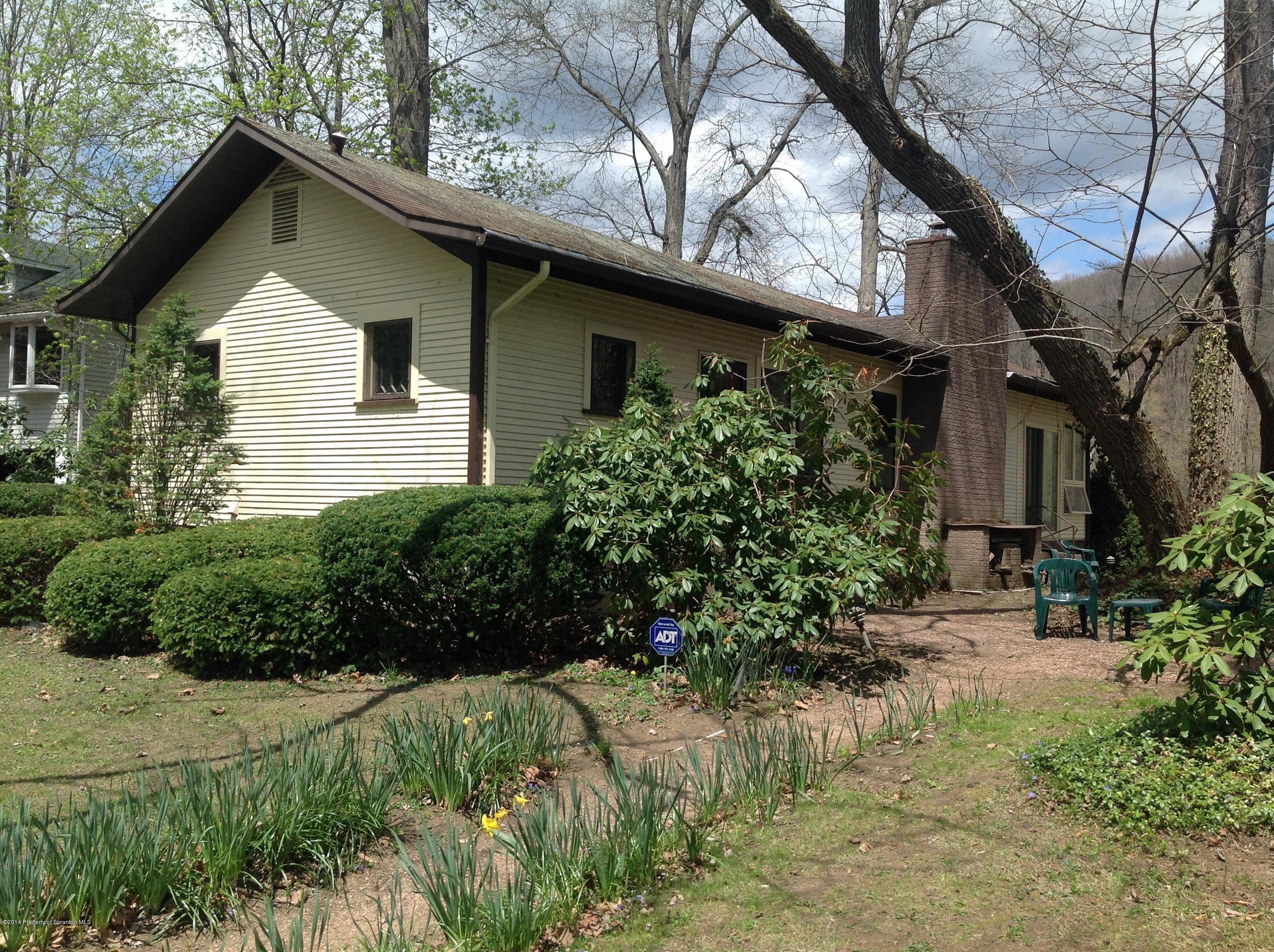 303 River Road Falls, PA 18615 - Photo 1 of 15 a front view of a house with a yard