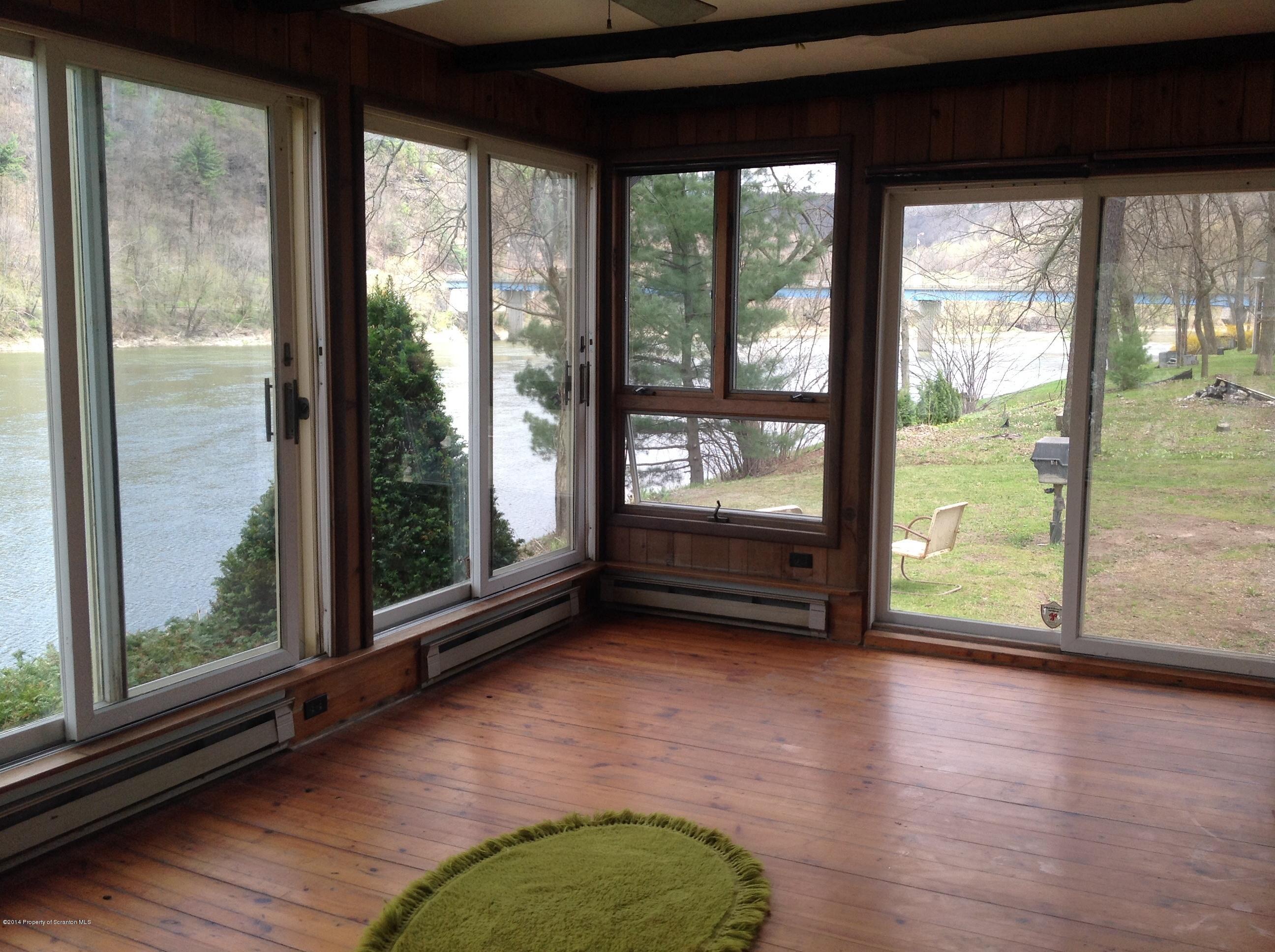 303 River Road Falls, PA 18615 - Photo 12 of 15 a view of a room with wooden floor and a window