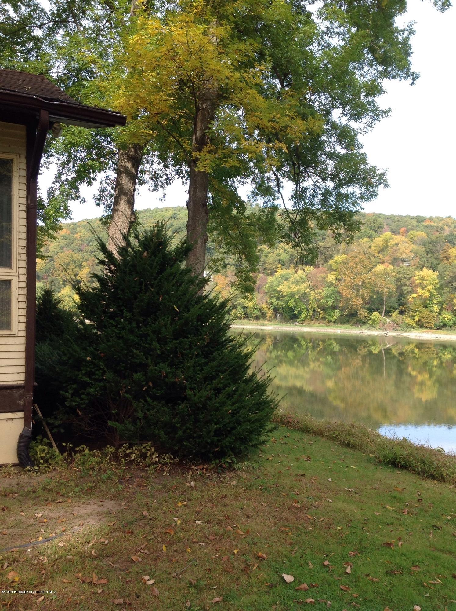 303 River Road Falls, PA 18615 - Photo 15 of 15 a view of a lake from a yard