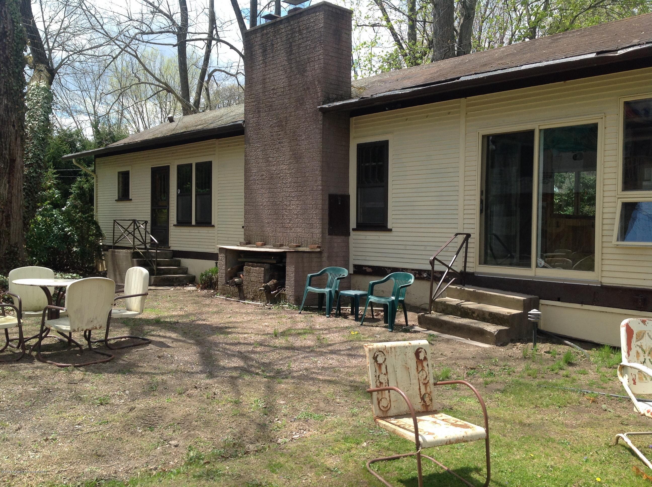 303 River Road Falls, PA 18615 - Photo 2 of 15 a view of backyard of house with outdoor seating