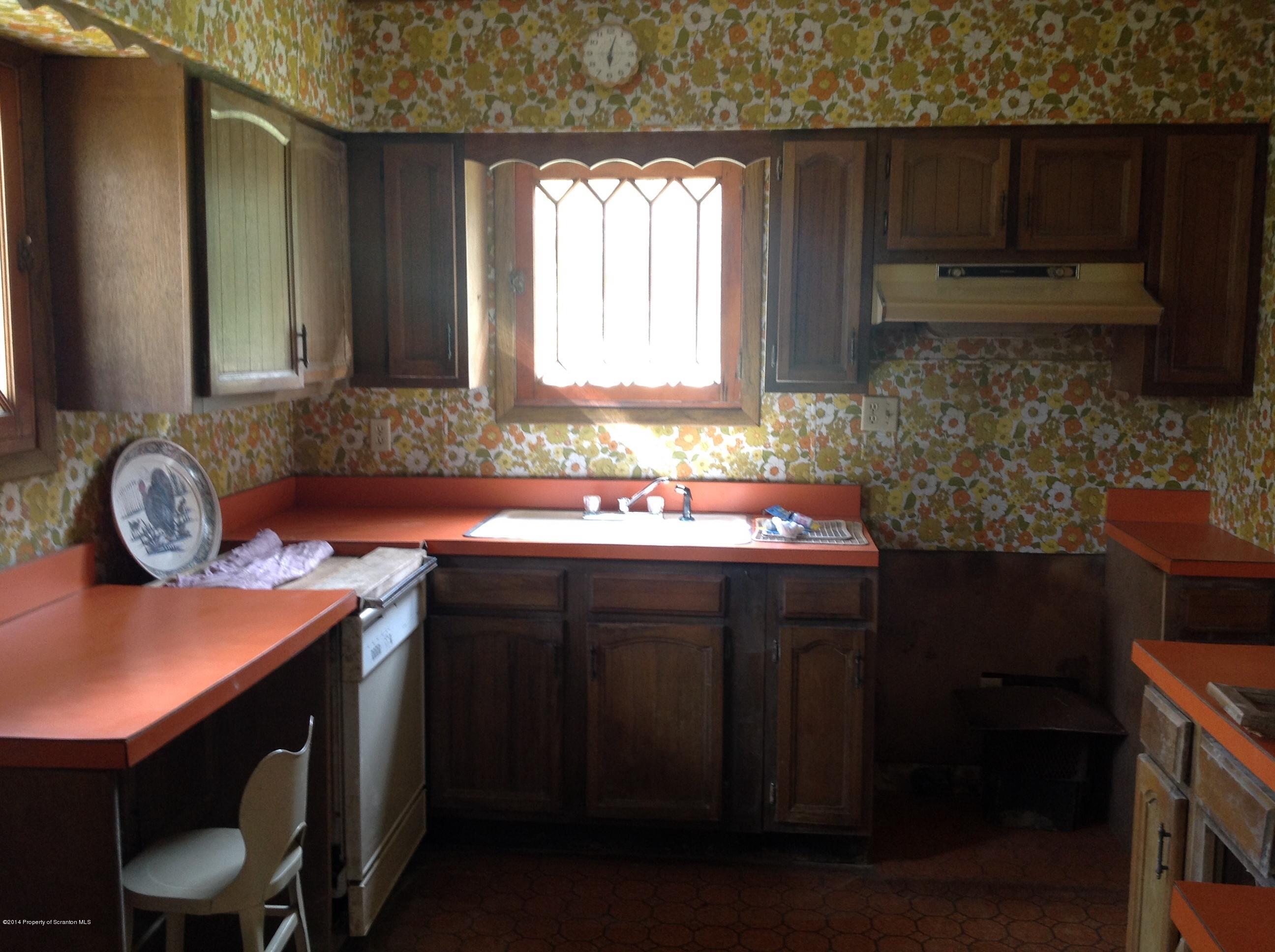 303 River Road Falls, PA 18615 - Photo 5 of 15 a kitchen with a sink cabinets and window