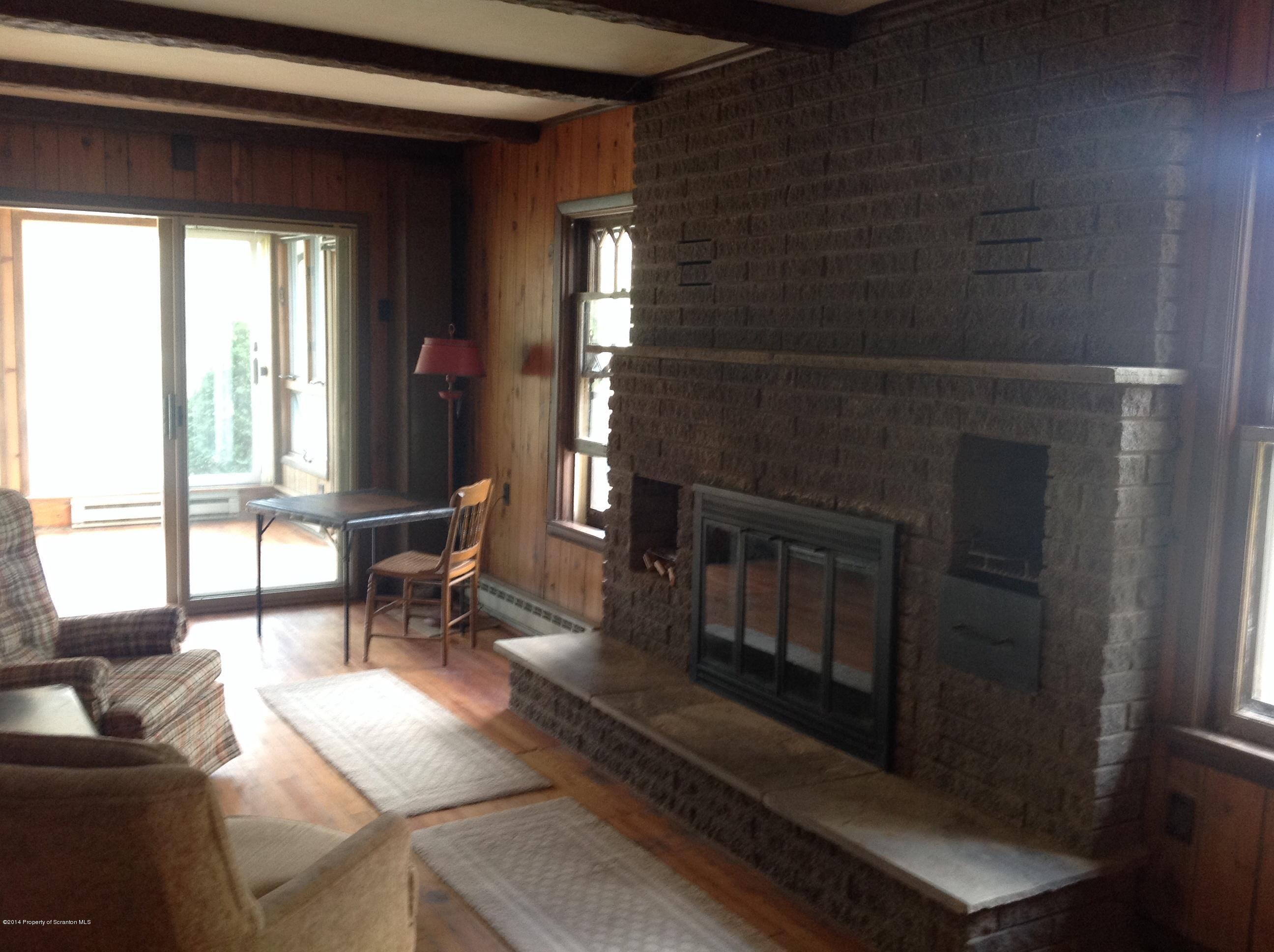 303 River Road Falls, PA 18615 - Photo 9 of 15 a living room with furniture and a fireplace