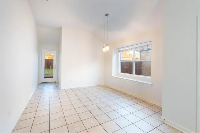 a kitchen with granite countertop cabinets and stainless steel appliances