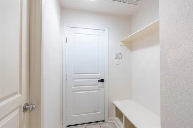 an empty room with wooden floor