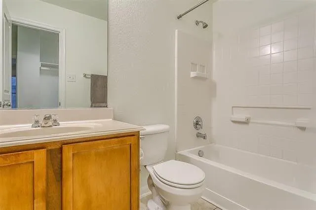 a view of bathroom with bathtub and shower