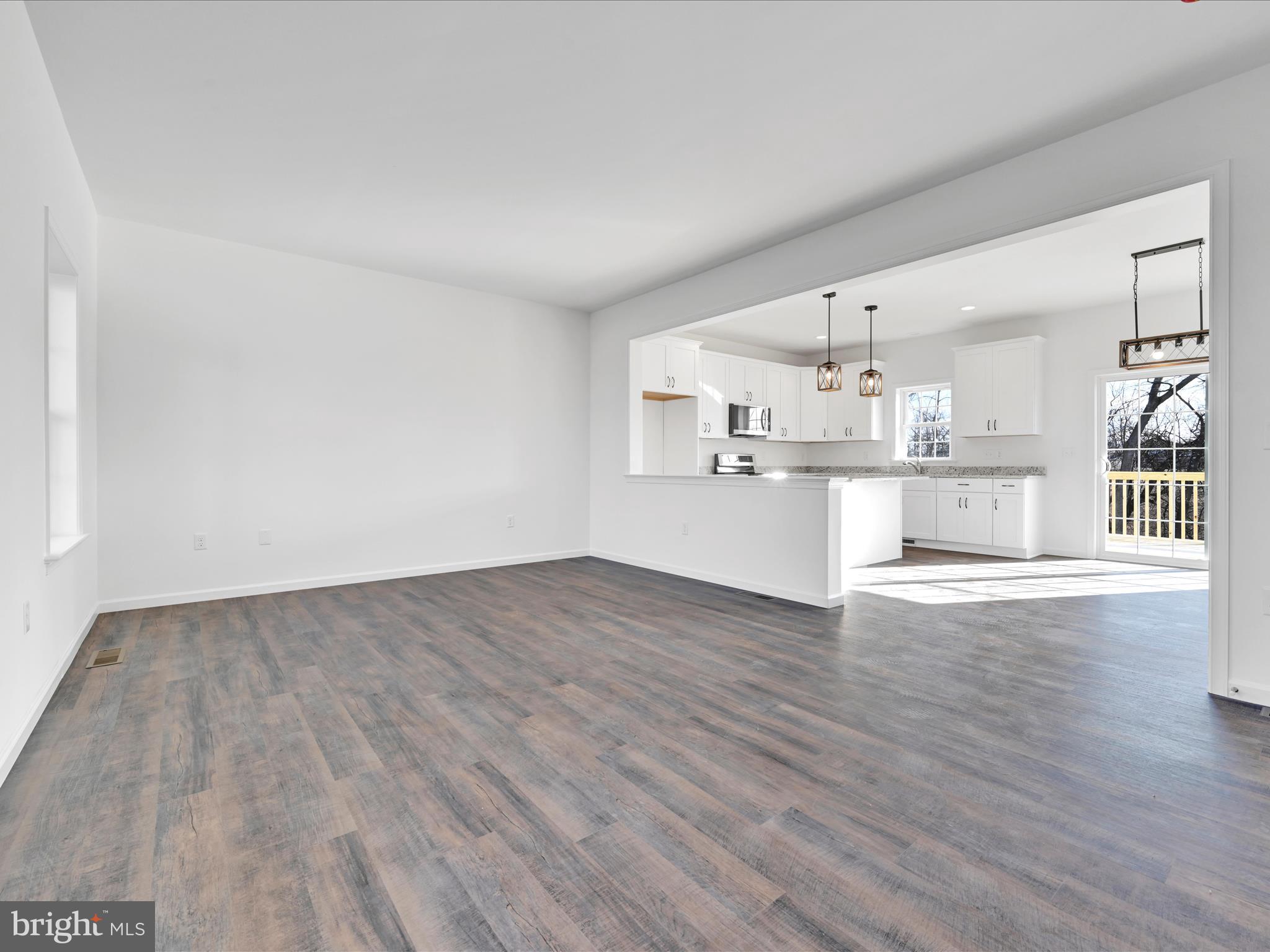 4 Stream Drive Carlisle, PA 17013 - Photo 3 of 39 a view of a kitchen with wooden floor and electronic appliances