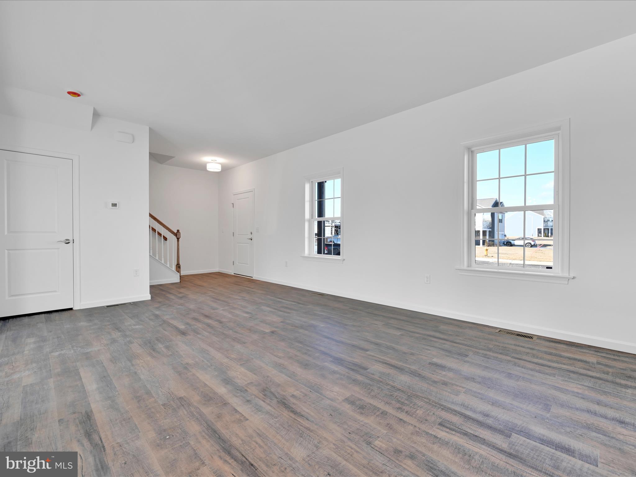 4 Stream Drive Carlisle, PA 17013 - Photo 4 of 39 a view of empty room with wooden floor and window