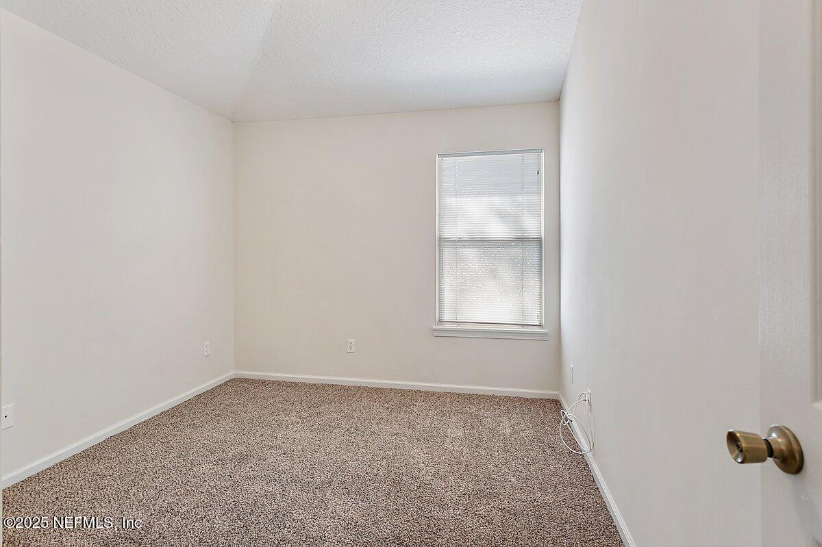 452 Dutton Island Road West Atlantic Beach, FL 32233 - Photo 13 of 28 an empty room with windows