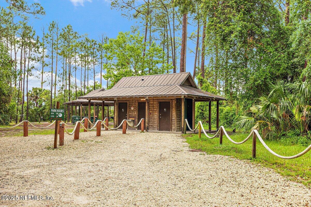 452 Dutton Island Road West Atlantic Beach, FL 32233 - Photo 19 of 28 an outdoor space with furniture and umbrella