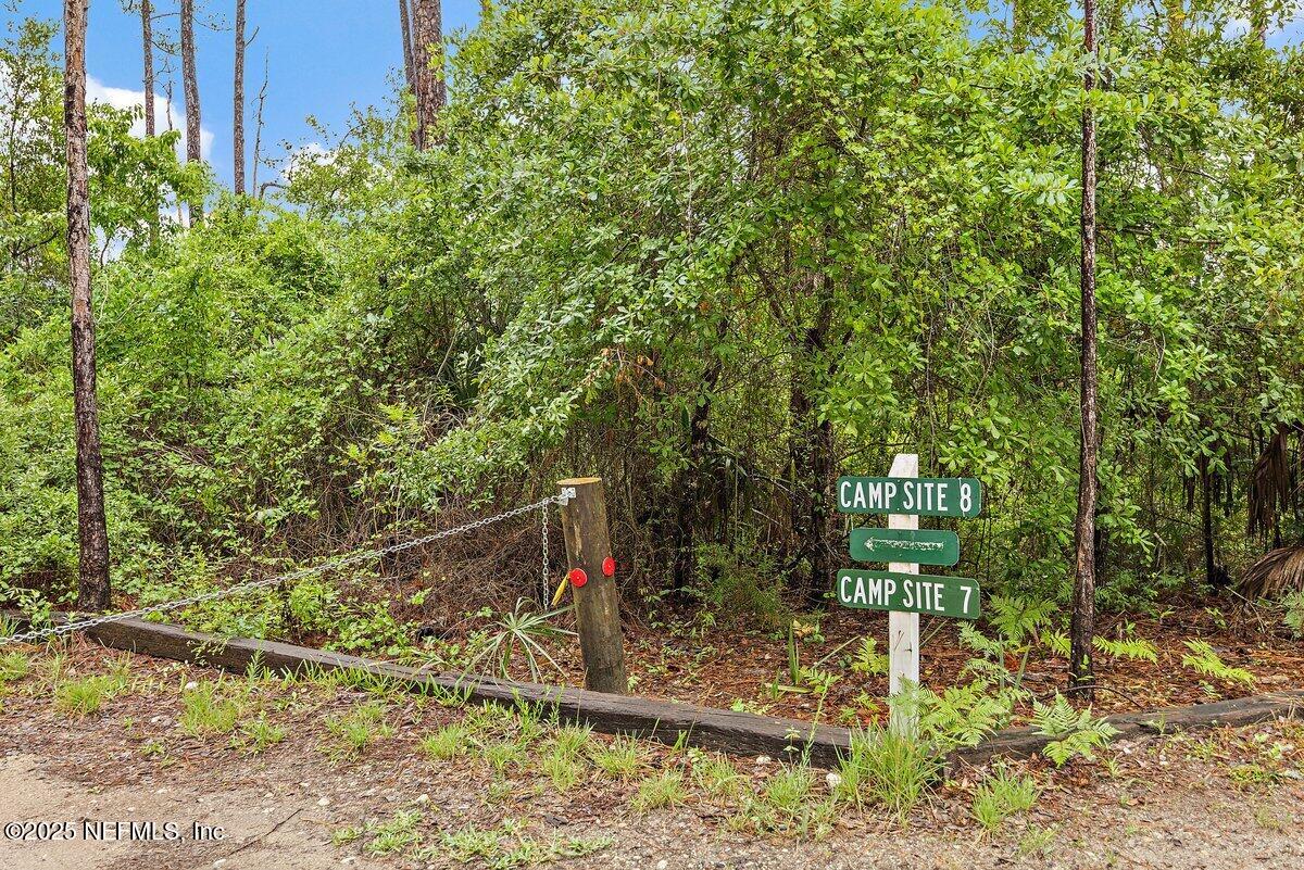 452 Dutton Island Road West Atlantic Beach, FL 32233 - Photo 20 of 28 a view of a wooden house and a yard