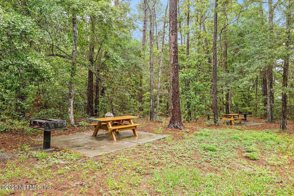 452 Dutton Island Road West Atlantic Beach, FL 32233 - Photo 24 of 28 a view of a backyard with sitting area