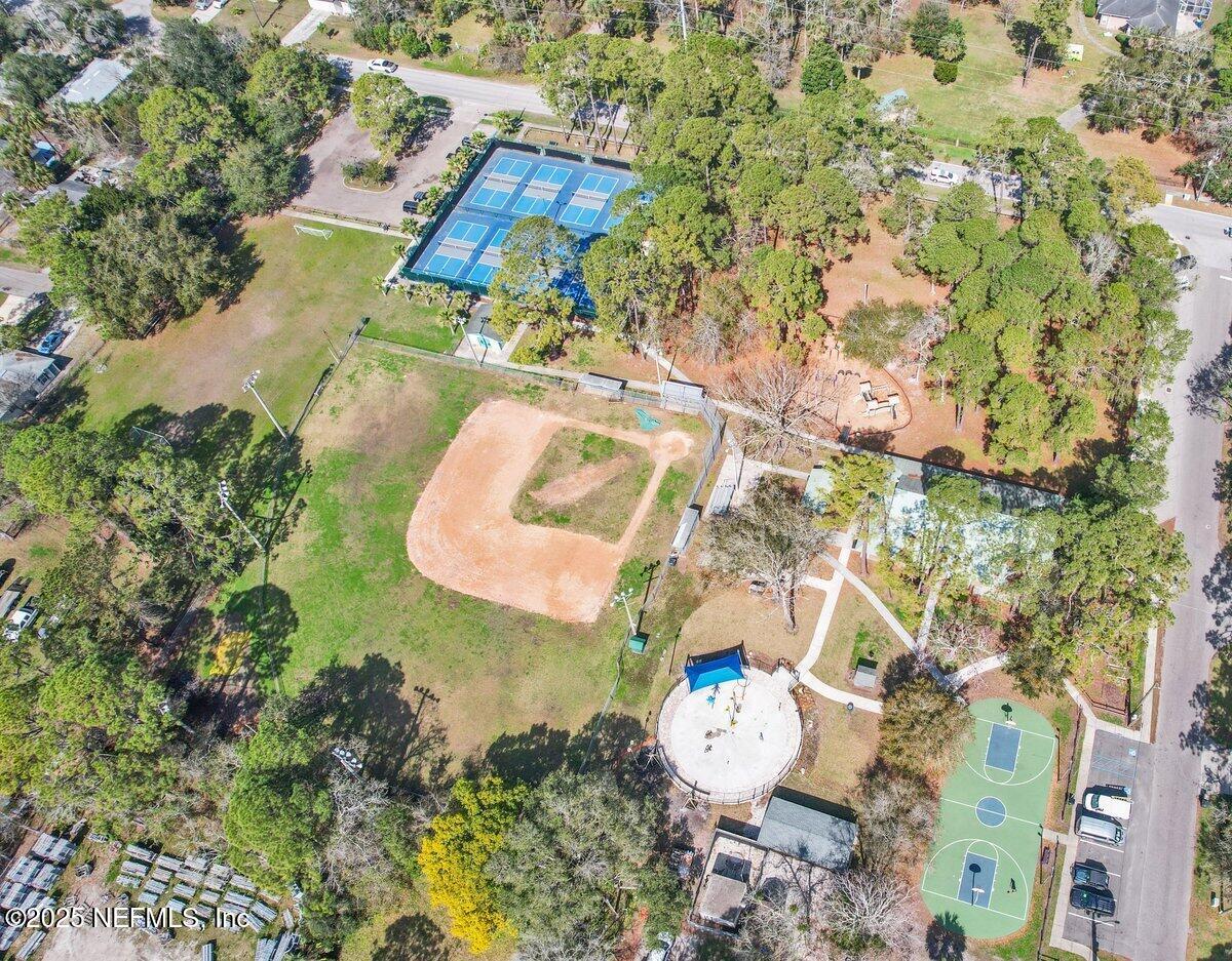 452 Dutton Island Road West Atlantic Beach, FL 32233 - Photo 28 of 28 an aerial view of a house with a yard and large trees