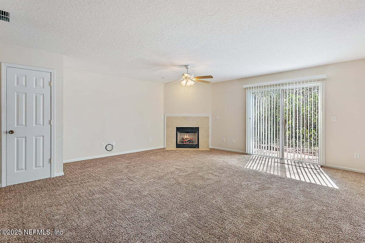 452 Dutton Island Road West Atlantic Beach, FL 32233 - Photo 4 of 28 a view of a livingroom with a fireplace