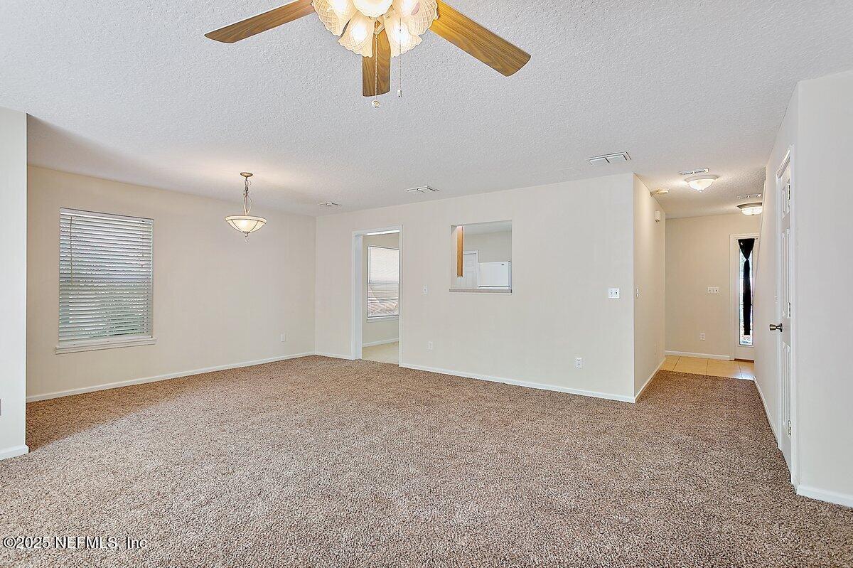 452 Dutton Island Road West Atlantic Beach, FL 32233 - Photo 5 of 28 a view of an empty room with a window