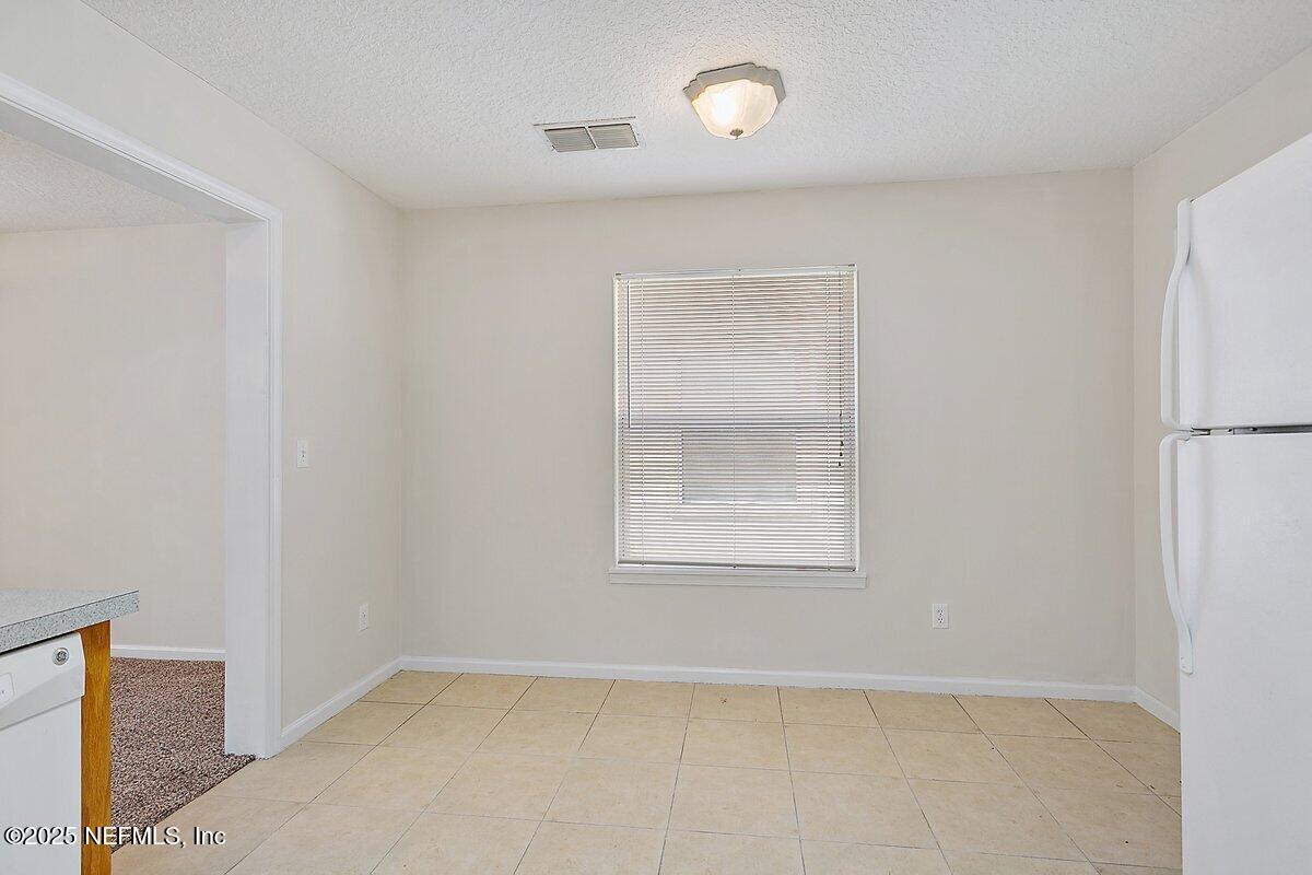 452 Dutton Island Road West Atlantic Beach, FL 32233 - Photo 6 of 28 an empty room with a window