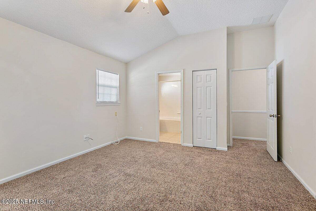 452 Dutton Island Road West Atlantic Beach, FL 32233 - Photo 10 of 28 an empty room with closet and windows