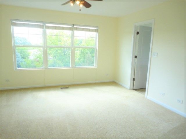 490 Grosvenor Lane Aurora, IL 60504 - Photo 12 of 16 an empty room with a window