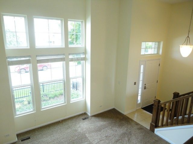 490 Grosvenor Lane Aurora, IL 60504 - Photo 4 of 16 a view of an empty room and window