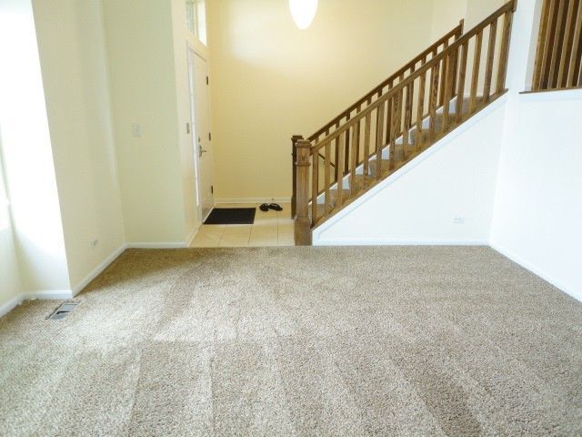 490 Grosvenor Lane Aurora, IL 60504 - Photo 5 of 16 a view of a hallway with staircase