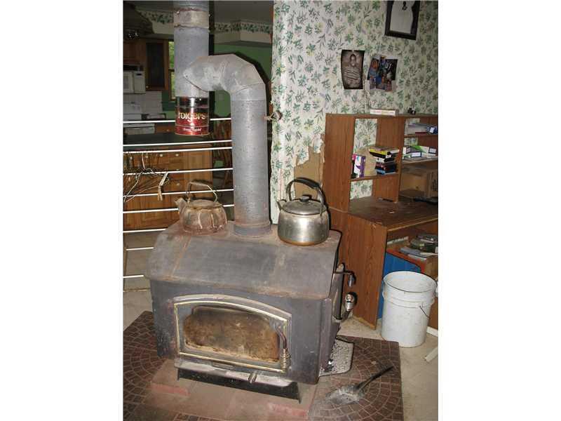 118 Guilford Center Road Guilford, ME 04443 - Photo 8 of 26 Interior Space/Layout. Wood Stove