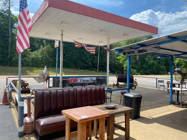 a view of a patio with a dining table and chairs